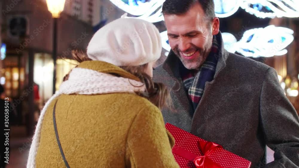 Mature man giving his lady the gift Mature man giving his lady the gift