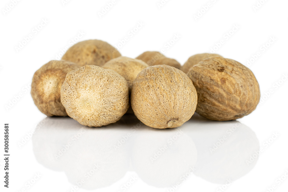 Group of seven whole dry brown nutmeg isolated on white background Group of seven whole dry brown nutmeg isolated on white background