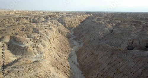 Aerial view over large Wadi with Soft sedimentary rock, Arava Desert Drone footage view over Wadi Amatzia Soft sedimentary rock, Arava Valley Isael photo