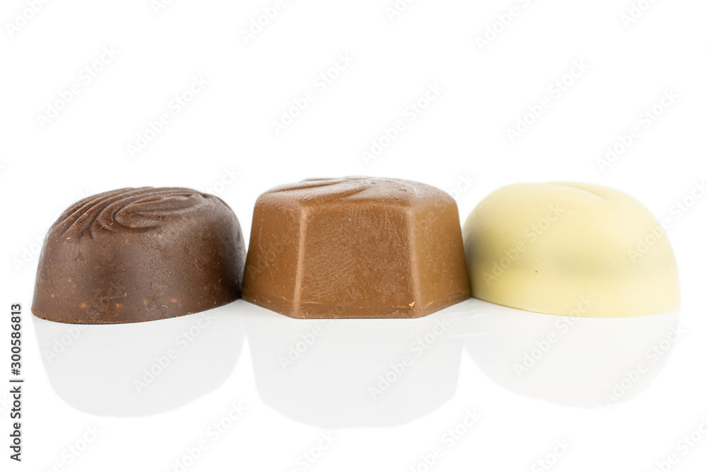 Group of three whole delicious chocolate praline isolated on white background Group of three whole delicious chocolate praline isolated on white background
