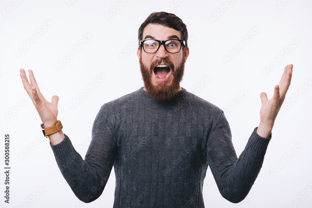 Photo of young amazed man gesturing over white background Photo of young amazed man gesturing over white background