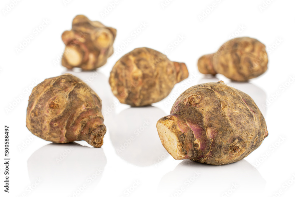 Group of five whole fresh brown jerusalem artichoke isolated on white background Group of five whole fresh brown jerusalem artichoke isolated on white background