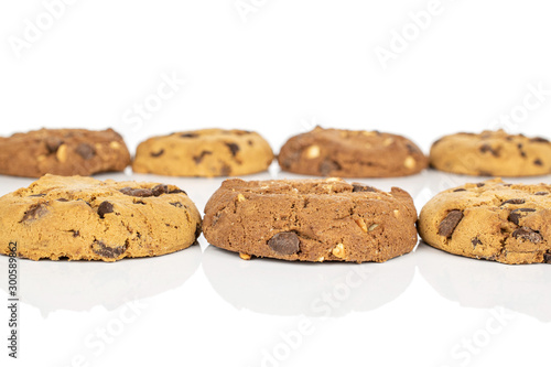 Group of seven whole sweet brown cookie isolated on white background