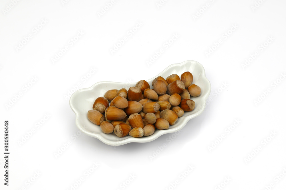 isolated haselnuts on cap isolated haselnuts on cap