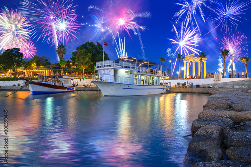 Fototapeta Naklejka Na Ścianę i Meble -  Fireworks display over the harbour with boats in Side, Turkey
