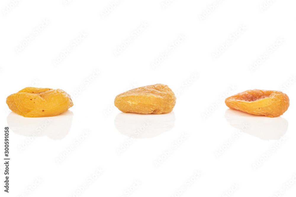Group of three whole dried orange apricot isolated on white background Group of three whole dried orange apricot isolated on white background