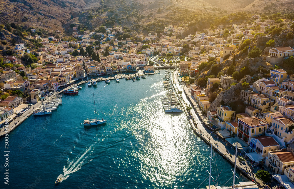 Symi, Dodecanese island, Greece. Beautiful bay with colorful houses on hillside of the island of Symi