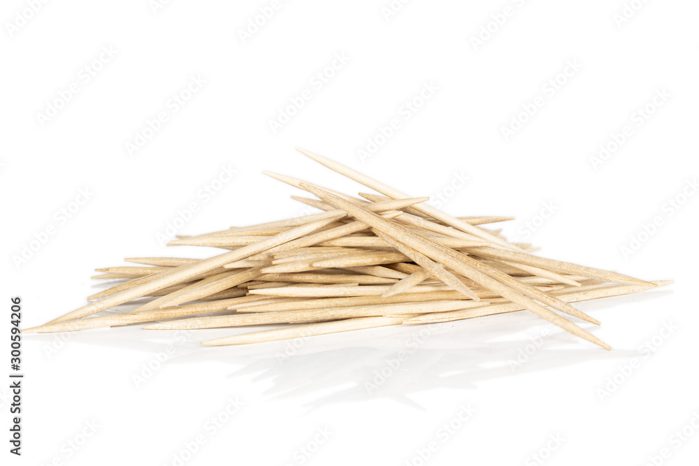Lot of whole wooden brown toothpick heap isolated on white background Lot of whole wooden brown toothpick heap isolated on white background