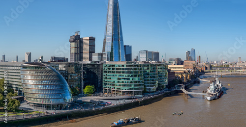 Aerial cityscape of the Thames river on a sunny day with the City Hall,skyscraper and London skyline.