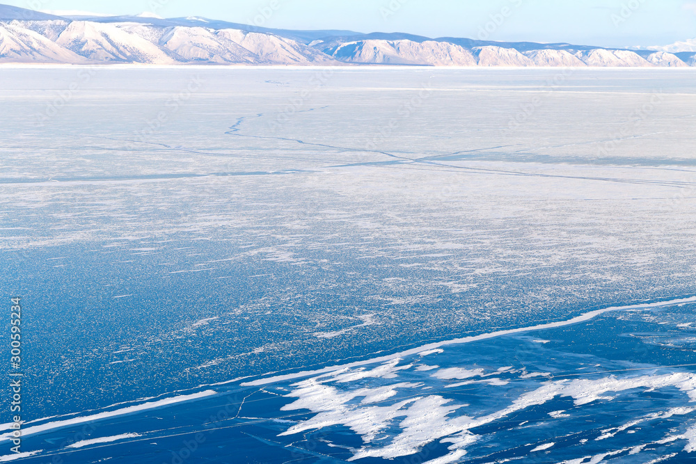 Winter landscape with lake covered with ice.Lake Baikal, Russia