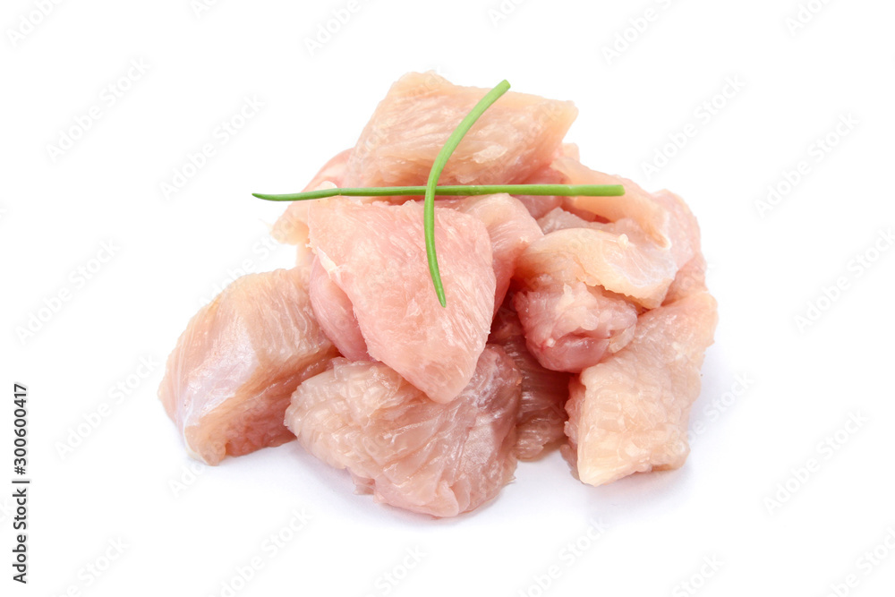 raw chicken fillet cut into pieces on a white background