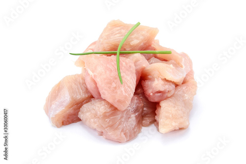 raw chicken fillet cut into pieces on a white background