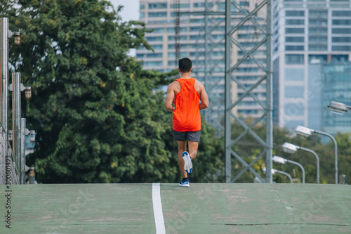 runner on the street be running for exercise; sport, people, exercising and lifestyle concept