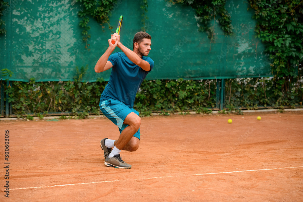 Portrait of a tennis player in action at outdoor court.