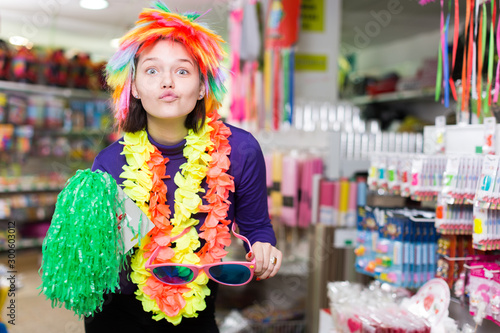 Girl in store of festival accessories