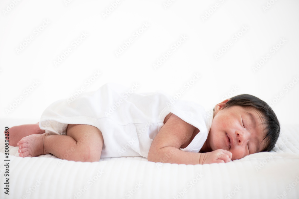 newborn baby sleep in bed on white background newborn baby sleep in bed on white background