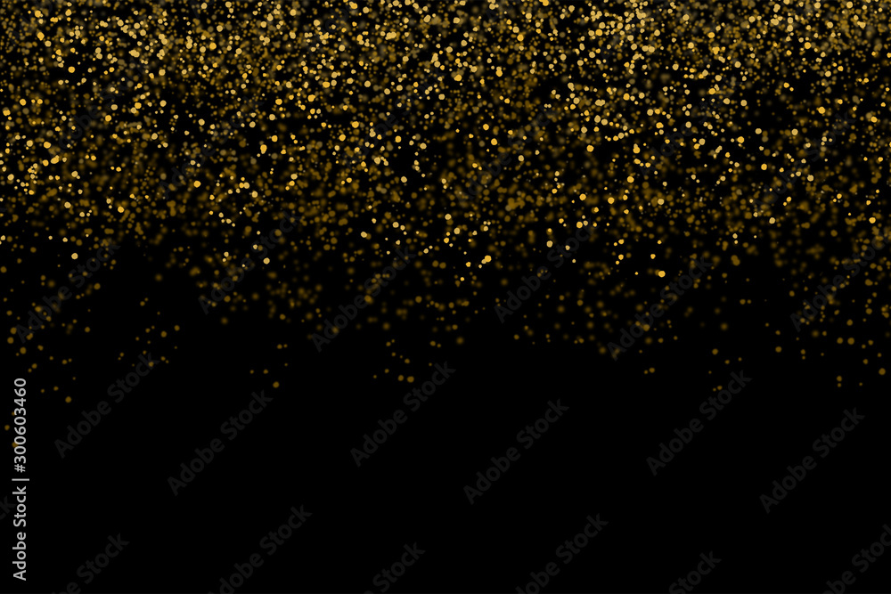 Golden confetti isolated on black background (clipping path) with bright festive tinsel of gold color for Christmas, new year, birthday party and greeting card decoration
