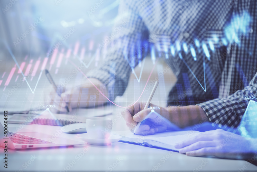 Multi exposure of forex chart with man working on computer on background. Concept of market analysis. Multi exposure of forex chart with man working on computer on background. Concept of market analysis.