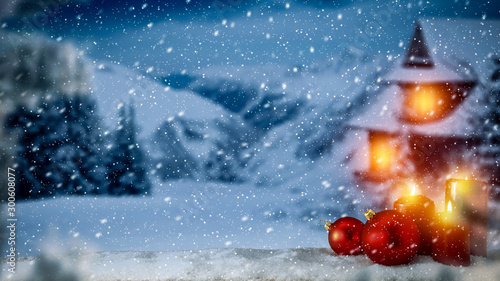 Christmas boxes with gifts of snowdrift are waiting for Christmas Eve dinner. Red ribbon and bow. Scene in front of Santa's house. Fir branches covered with frost. Red candles with warm light.  © magdal3na