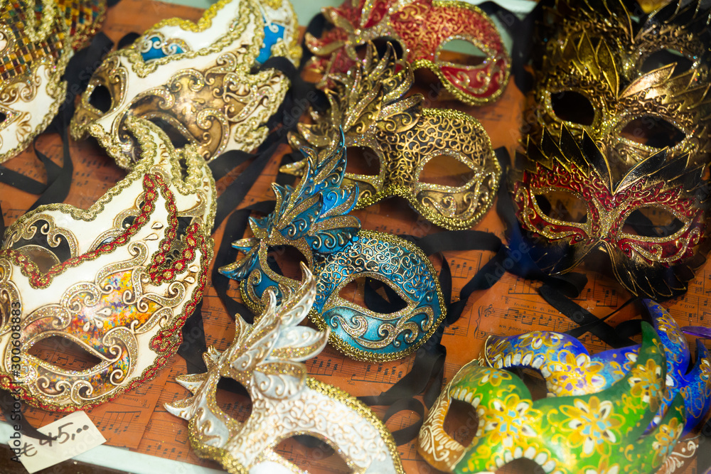 Traditional venician masks on shelves in souvenirs shop in Venice