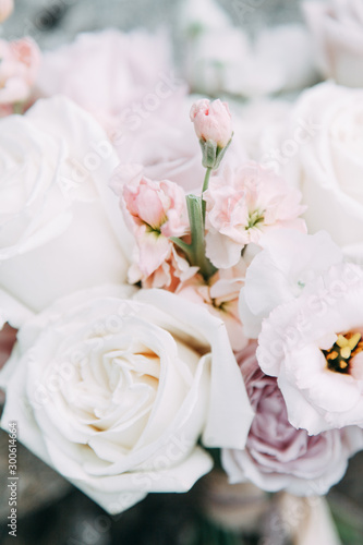 Printing and decor for a wedding with flowers. Modern Bridal bouquet in hand.