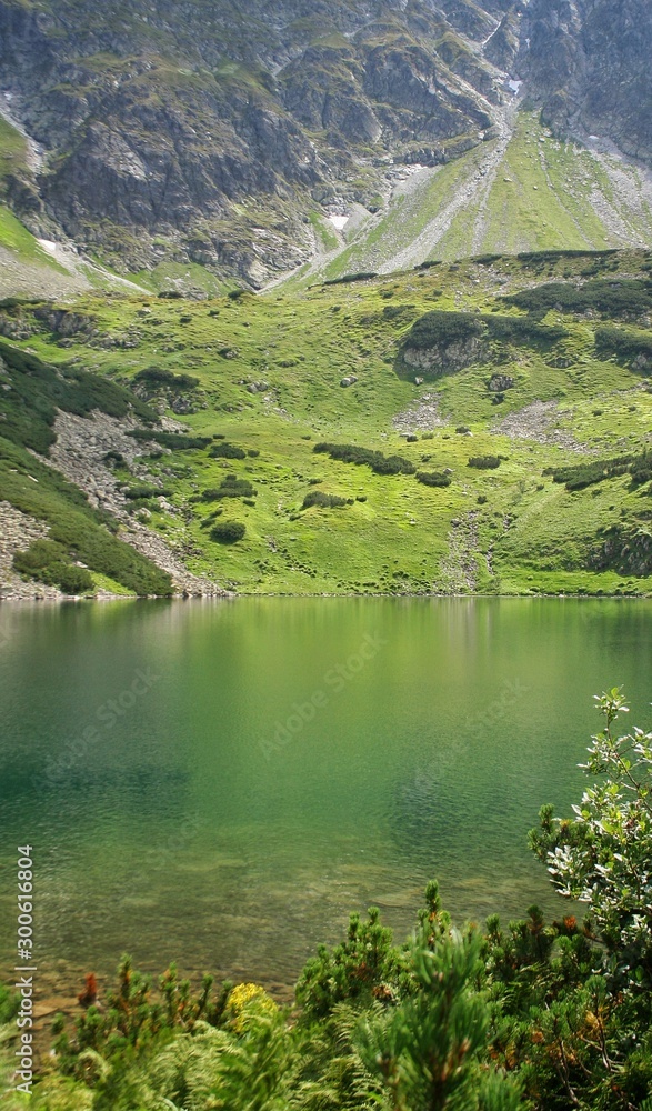 Fototapeta premium Wielki Staw in Poland. Valley of five ponds in the Tatra Mountains Europe Poland.