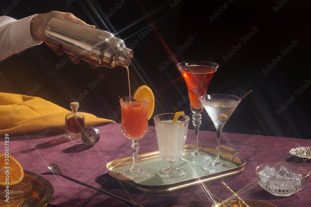 Cocktails in vintage style. Screwdriver, gin lemon, vermuth and Martini