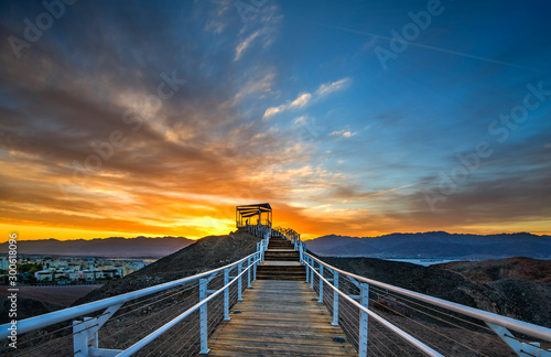 Sunrise at  a top of the mount with illuminated pergola, public park in vicin...