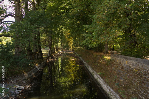 Stream in castle garden of the castle Chenonceau in France,Europe photo