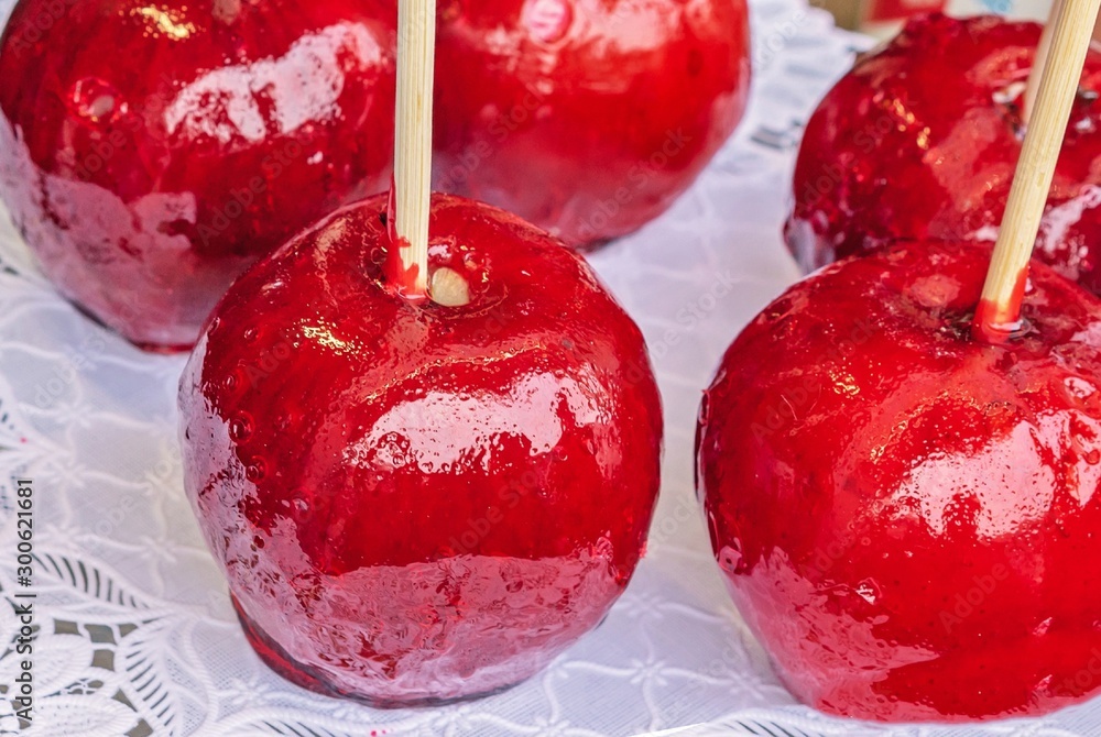 Candy Apple or Taffy Apple - red caramelized apples on a stick.