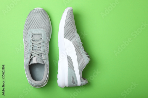 men's sneakers on a colored background top view. men's footwear. minimalism