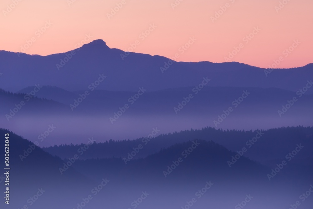 View on fog and hills in sunny autumn day. Beautiful background concept