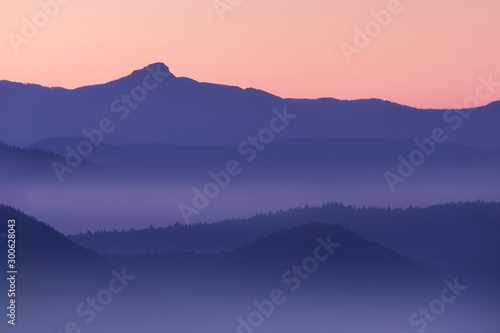 View on fog and hills in sunny autumn day. Beautiful background concept