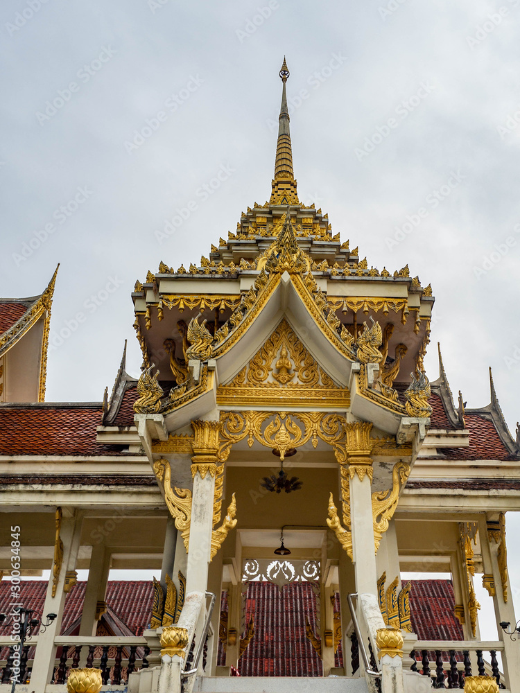 Crematory architecture style Thai with details texture is beautiful golden in temple name is Wat kaew at Bangkok Thailand,In date sky cloudy Crematory architecture style Thai with details texture is beautiful golden in temple name is Wat kaew at Bangkok Thailand,In date sky cloudy