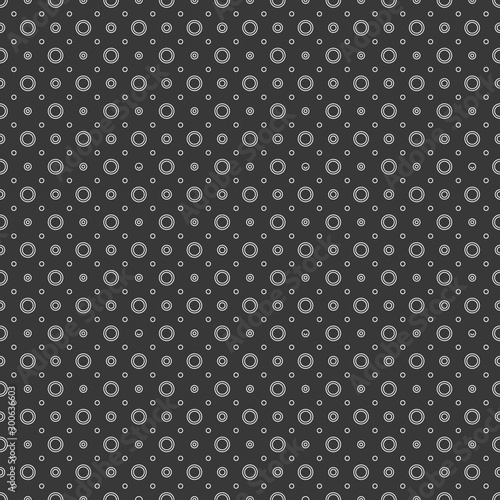 White circles and dots on a black background. Abstract seamless circles background. © flexelf