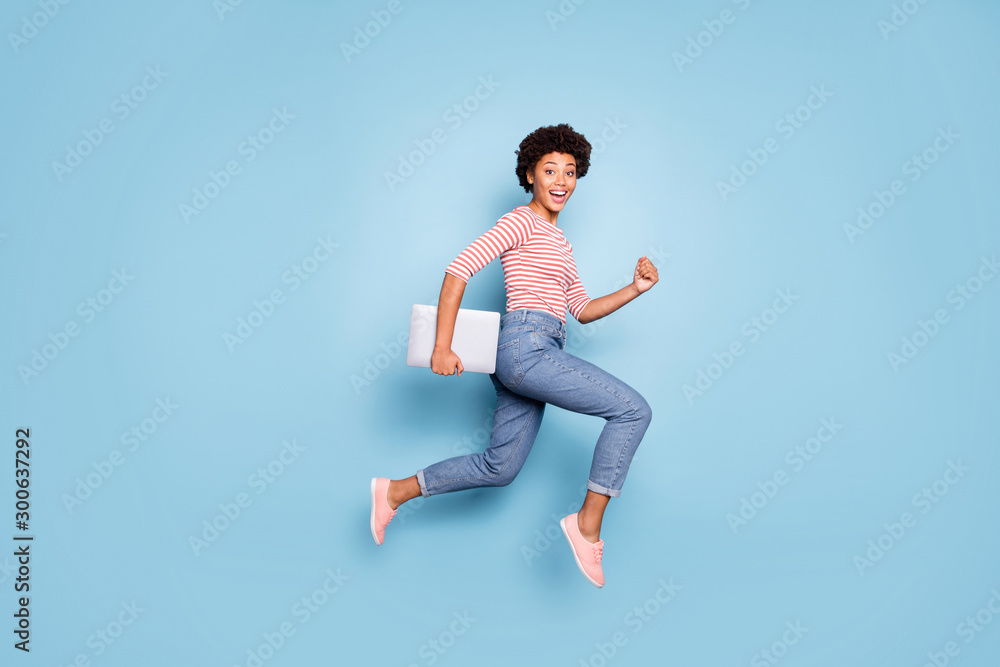 © deagreez - Full length body size profile side photo of excited crazy cheerful positive nice pretty sweet youngster wearing jeans denim striped shirt footwear isolated blue pastel color background © deagreez - Full length body size profile side photo of excited crazy cheerful positive nice pretty sweet youngster wearing jeans denim striped shirt footwear isolated blue pastel color background