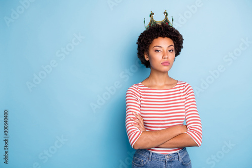 Photos Photo of arrogant coronated woman feeling power after being crowned with arms cr