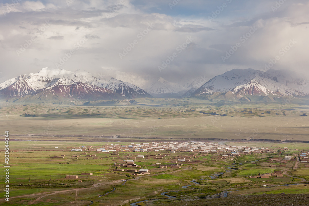 Kyrgyzstan, general view of Sary-Moghul and snow-capped Lenin Peak in the background