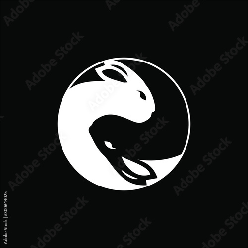 Twin rabbit head emblem or badge logo template isolated in black with yin and yang concept