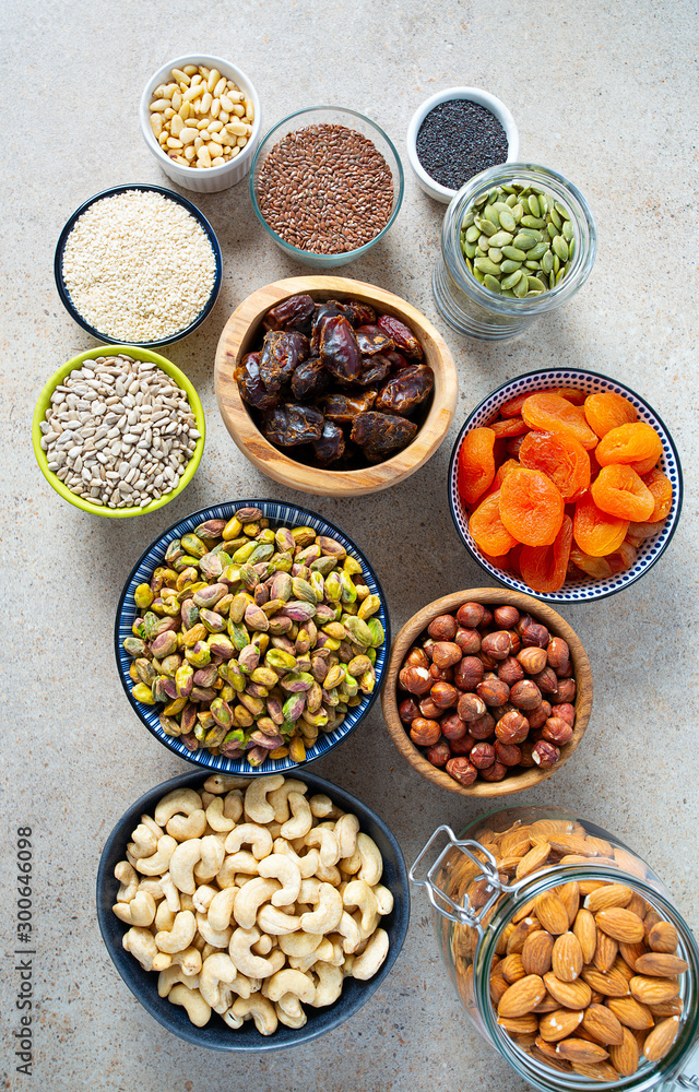 fresh nuts and dried fruis on granite surface fresh nuts and dried fruis on granite surface