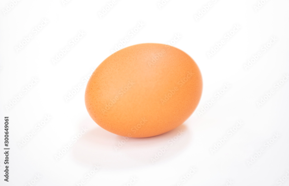 Raw single brown chicken egg isolated on the white background, cooking healthy food Raw single brown chicken egg isolated on the white background, cooking healthy food