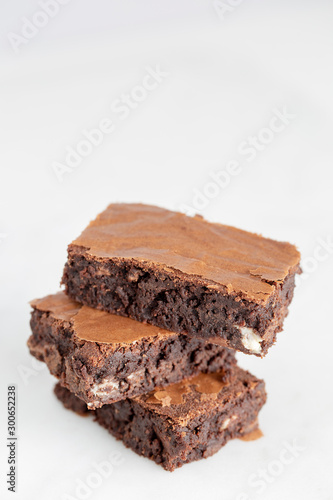 brownies chocolate three stacked on white background
