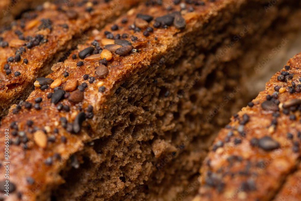 Fototapeta premium sliced wholegrain bread. Whole grain rye bread with seeds