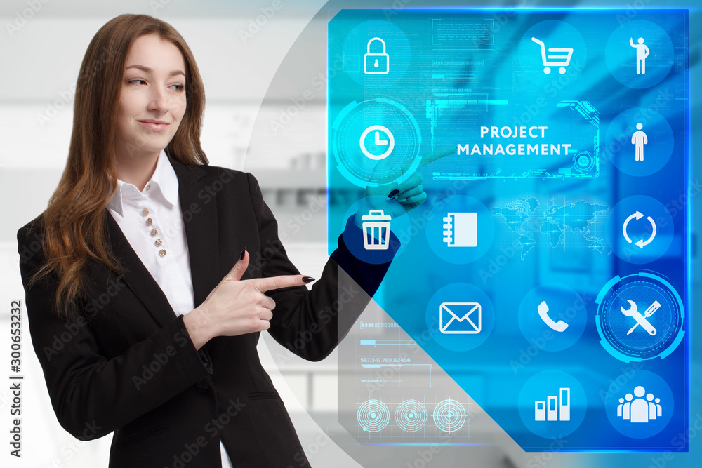 Business, Technology, Internet and network concept. Young businessman working on a virtual screen of the future and sees the inscription: Project management Business, Technology, Internet and network concept. Young businessman working on a virtual screen of the future and sees the inscription: Project management