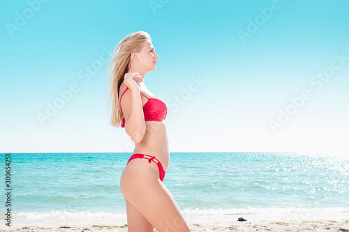 Portrait of blonde in swimsuit at the sea.