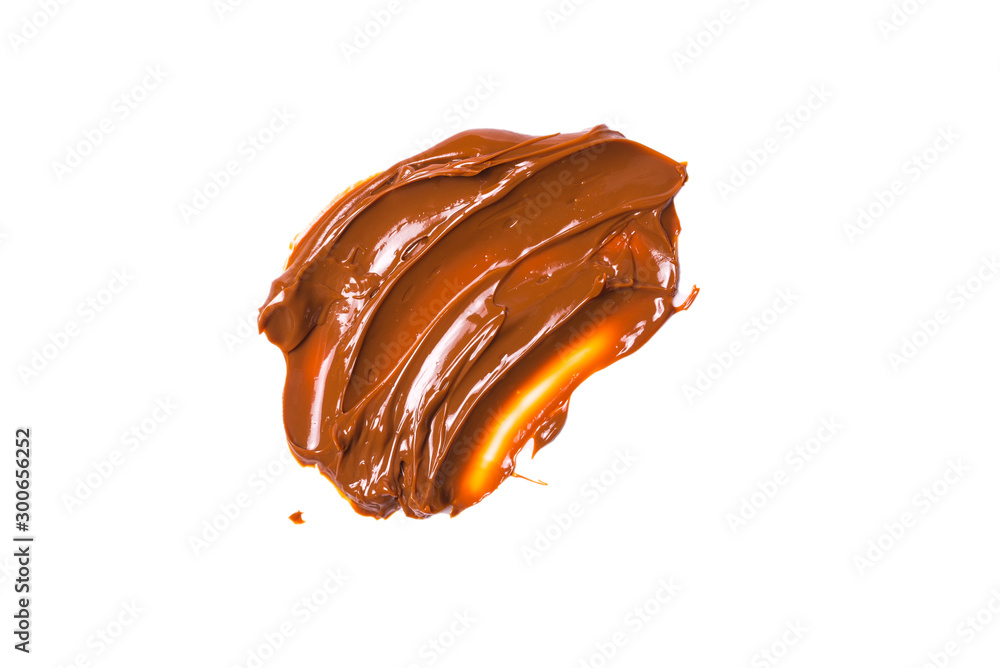 Melted tasty caramel splashes isolated on white background. Melted tasty caramel splashes isolated on white background.