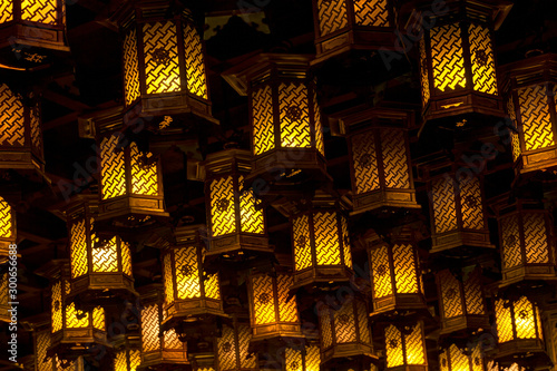 Thousands of lanterns hanging on the ceiling of Buddhist temple Shrine. photo