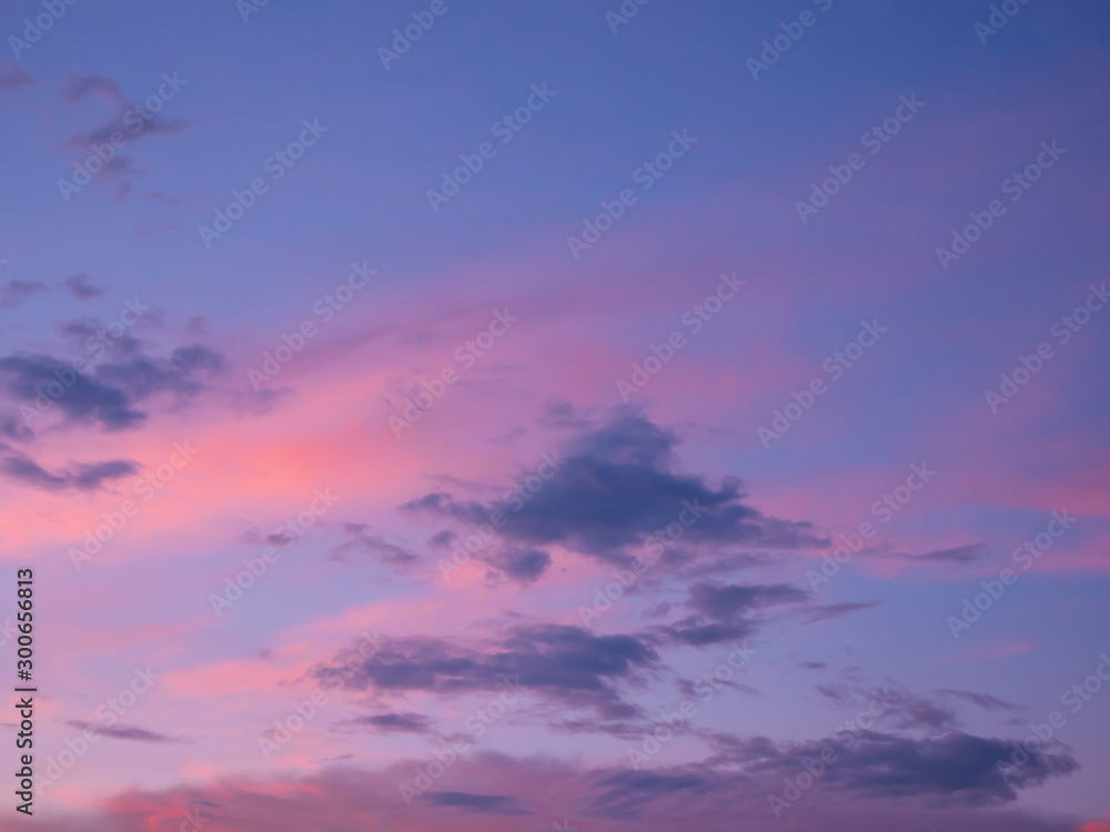 Sky and clouds in blue orange pink color in evening