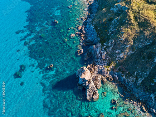 Aerial view of Tropea beach, crystal clear water and rocks that appear on the beach. Rock Pizzuta. Calabria, Italy