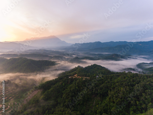 Aerial image of Amazing Beautiful Nature landscape view of Sunrise with nature misty foggy and Mount Kinabalu, Sabah, Borneo
